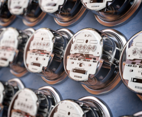 Electric meters in a row measuring power use.