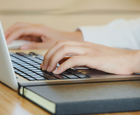 Closeup hand typing on keyboard