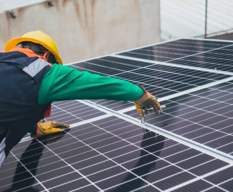 Solar Technician Installing Solar Panel